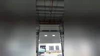 Высокая подъемная промышленная дверь с окном